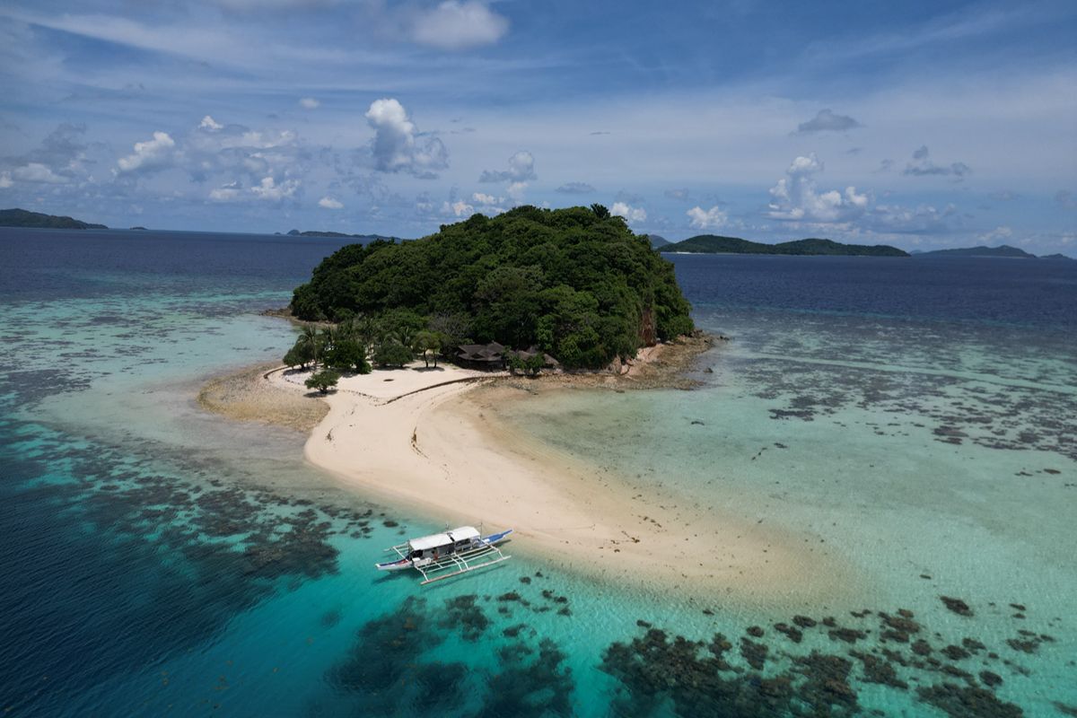 Bamboo Private Island in Palawan, Philippines, an exclusive luxury beachfront retreat with pristine white sand, turquoise waters, and eco-friendly villas surrounded by nature.