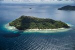 Aerial view of Ariara Private Island in Palawan, a luxury private island for rent with white sand beaches, turquoise waters, and exclusive beachfront villas.